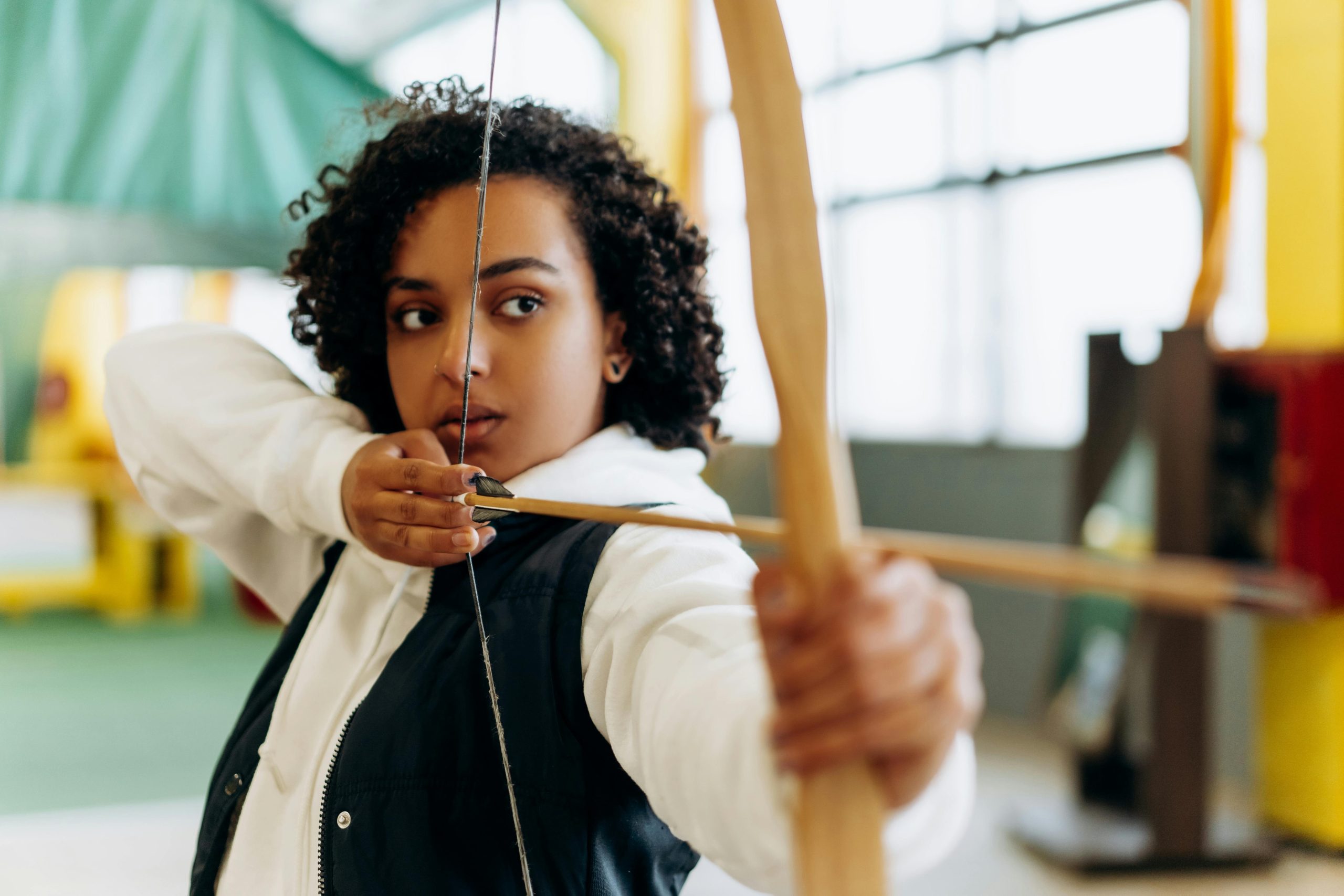 A woman introducing verbal cues while practicing hand targeting with her cat
